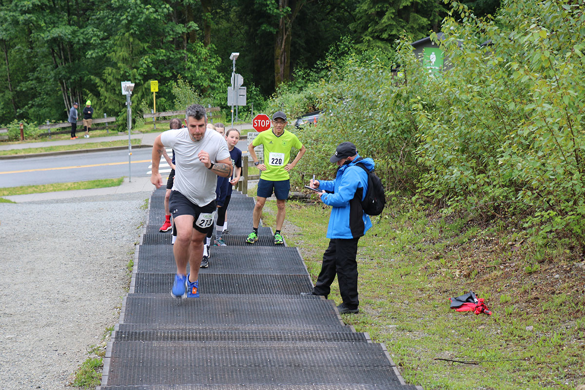 Man running up the 437 stairs for the Coquitlam Crunch stairmaster event