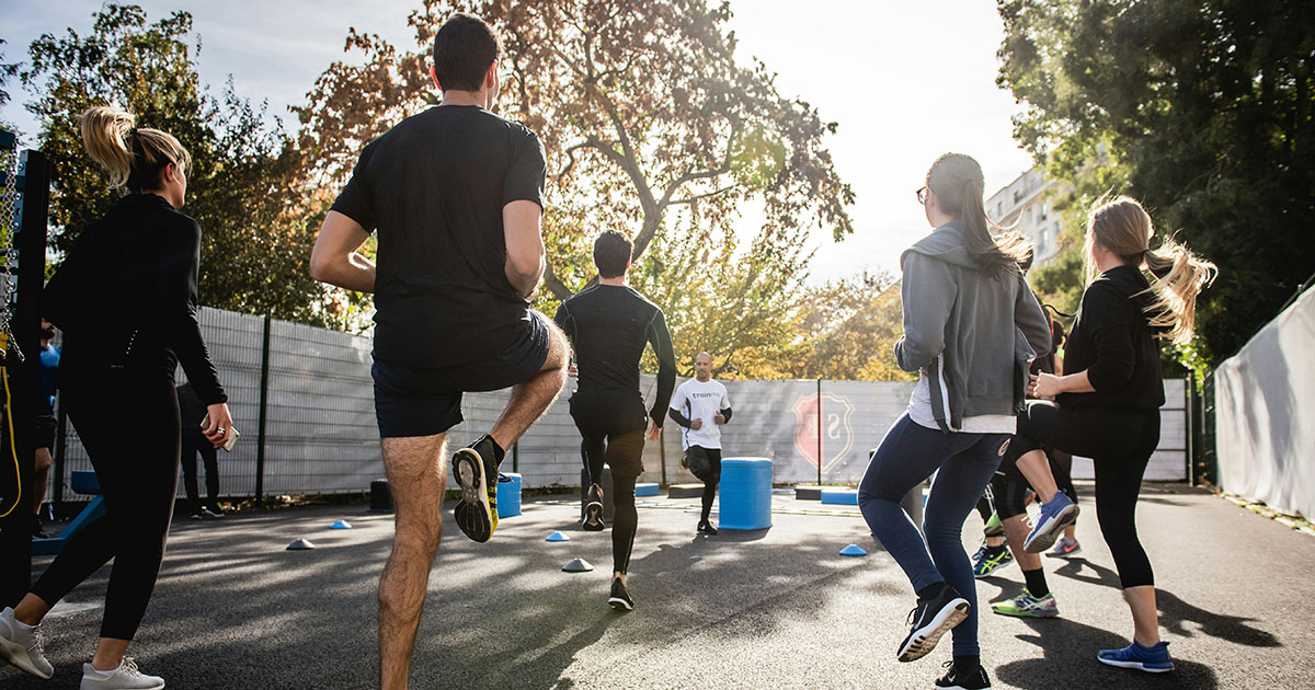 Groupl working out together1200x630 Group of runners working out together